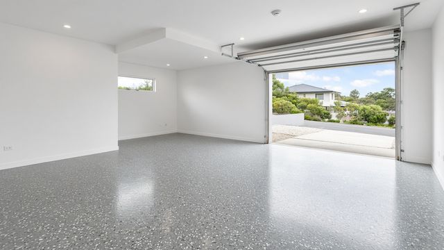 Illustrative example: grey flake epoxy garage floor with a gloss finish
